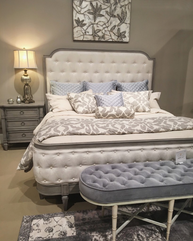 A beautifully tufted bed and bench