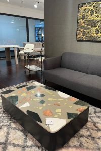 a rounded edge rectangular terrazzo top coffee table